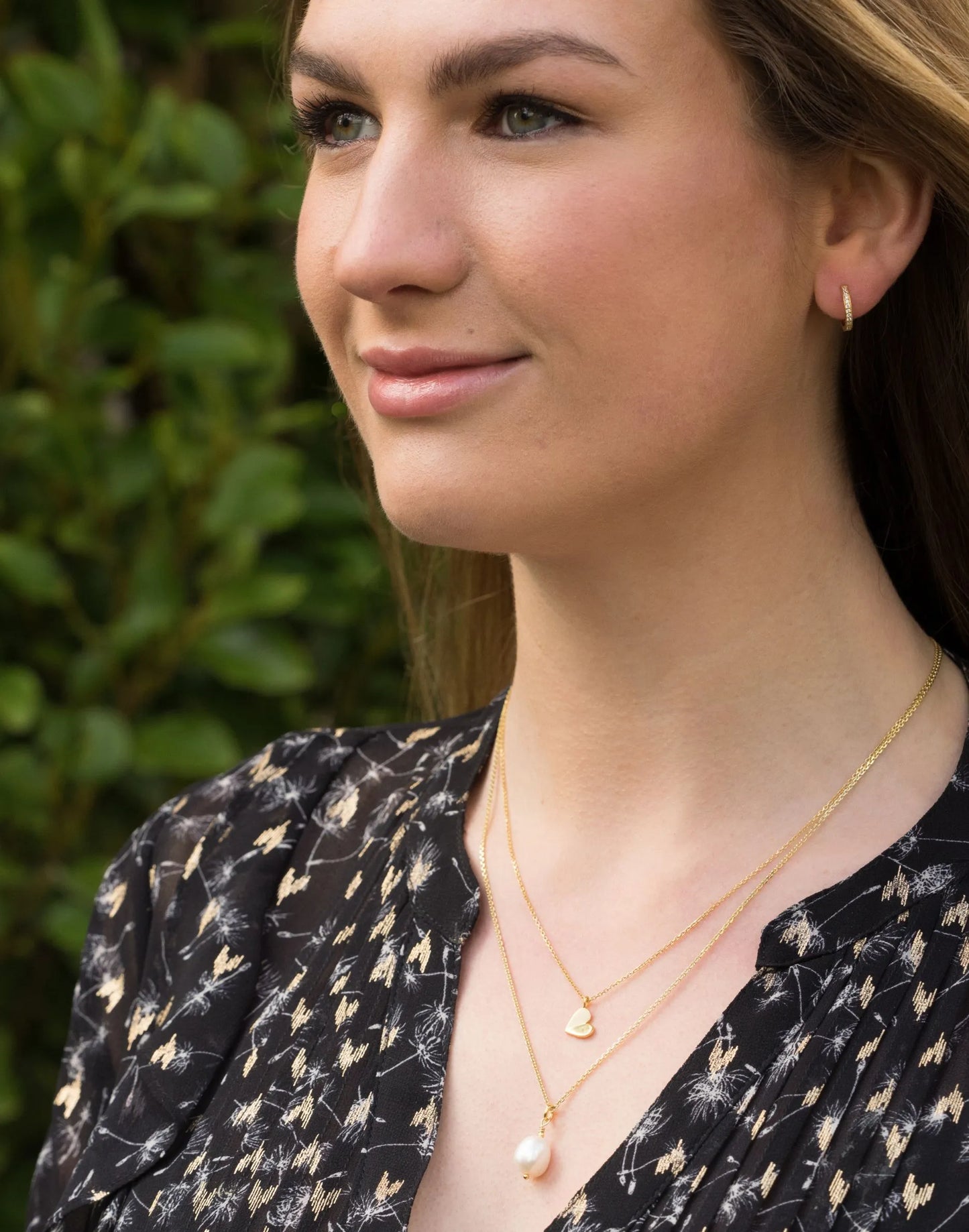model wears April birthstone White topaz huggie earrings