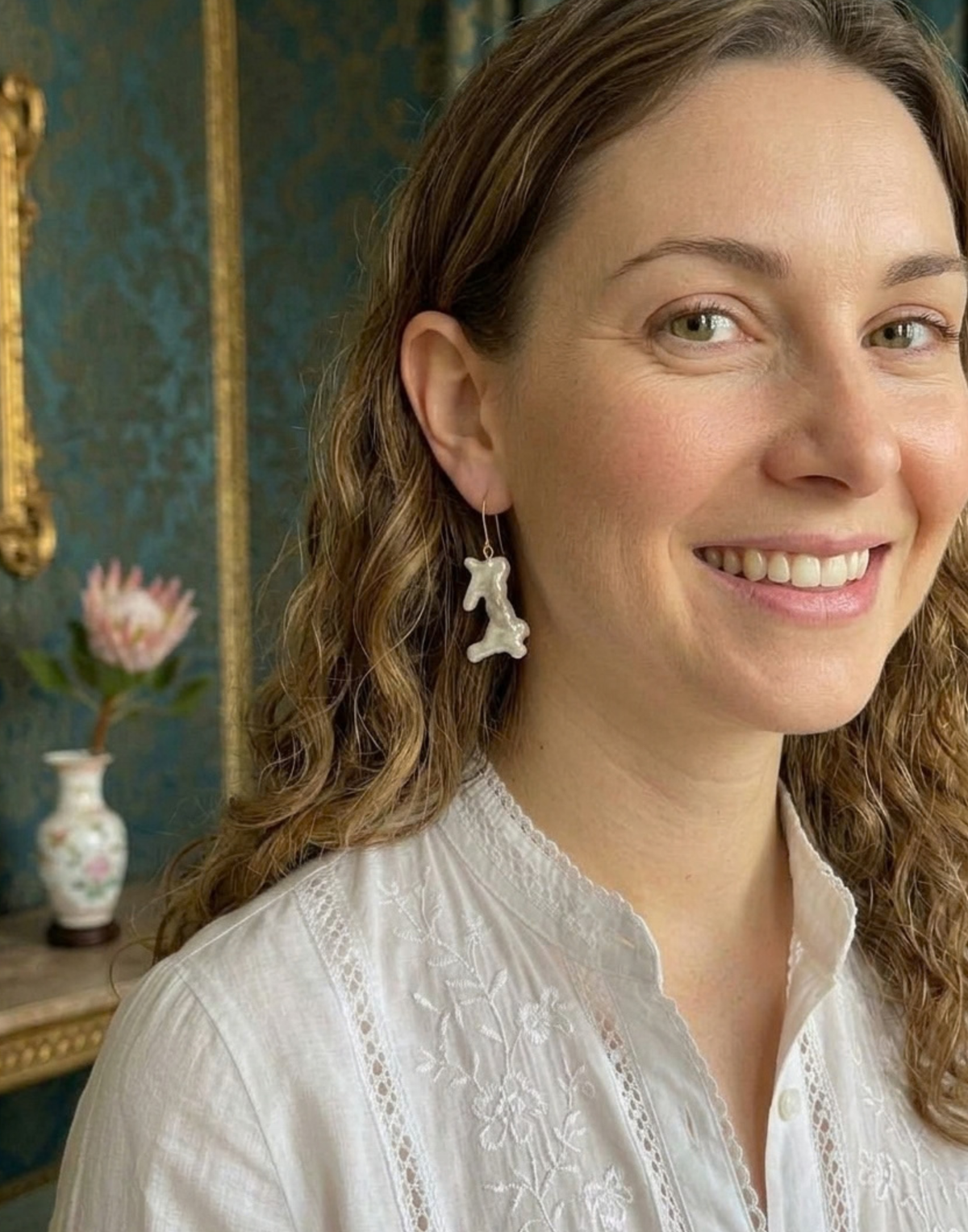 Bex Dangly pearl earrings on model