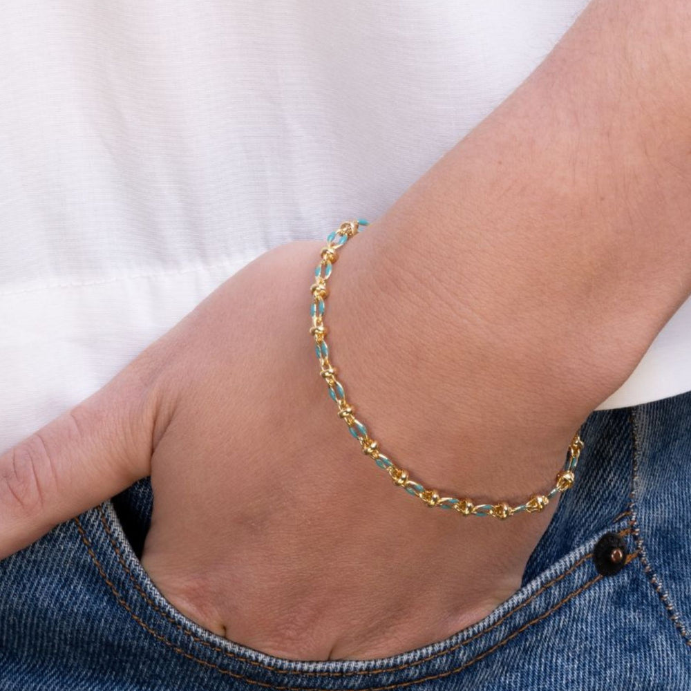 
                  
                    Model wears blue enamel bracelet
                  
                