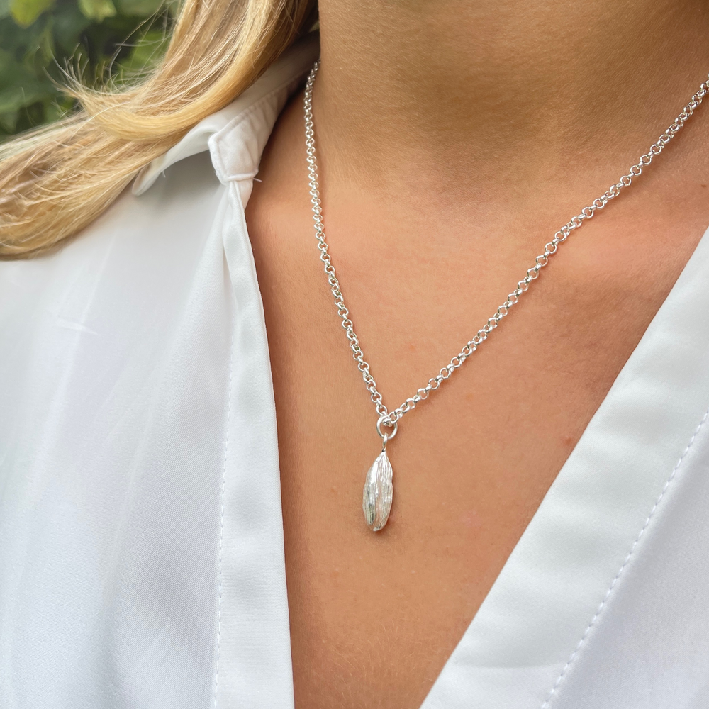 model wears silver cardamon necklace