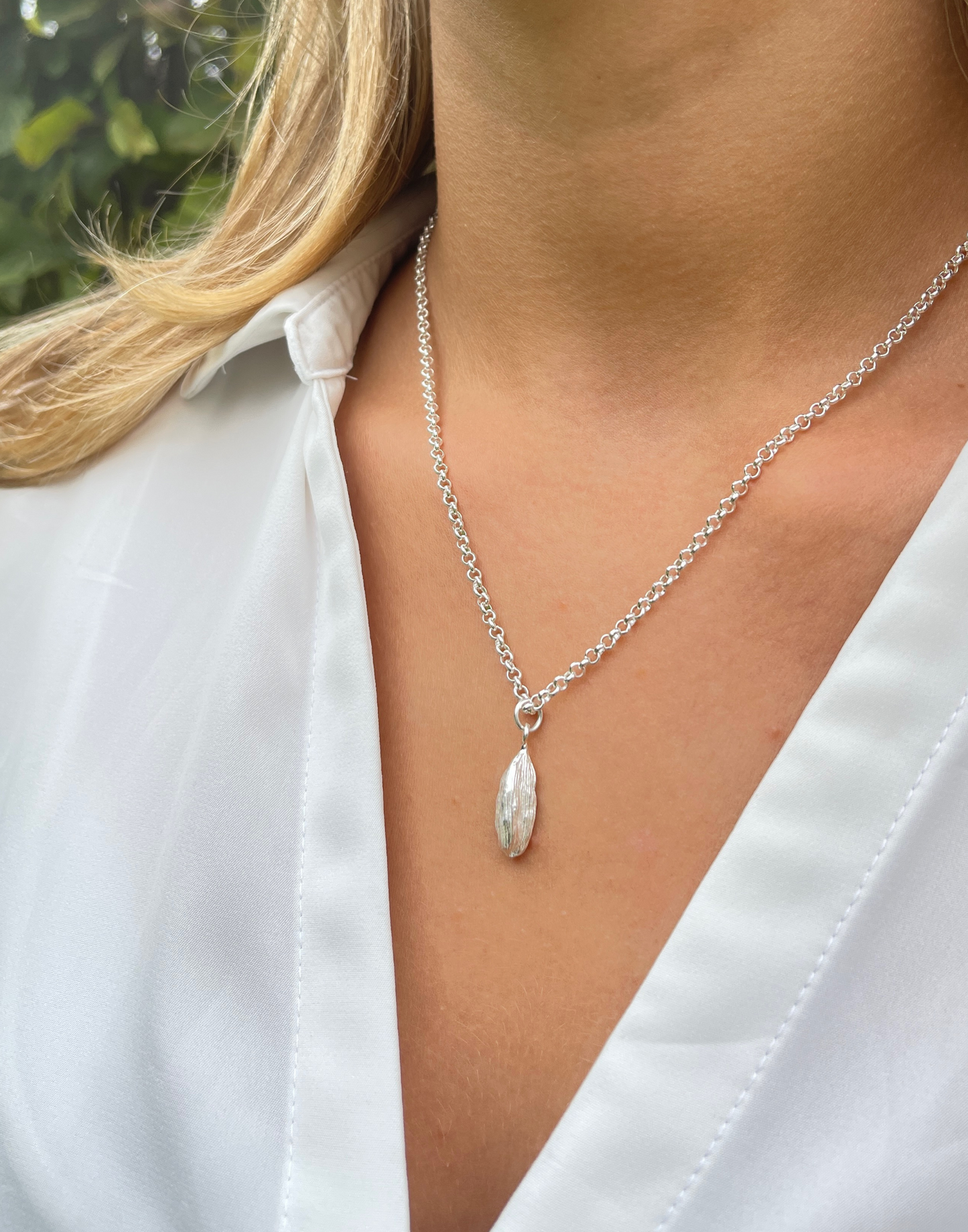 model wears silver cardamon necklace