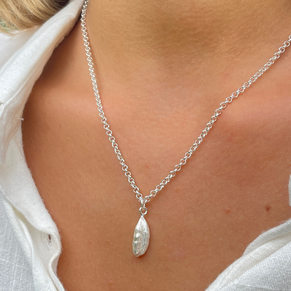 cardamon silver pendant necklace on model