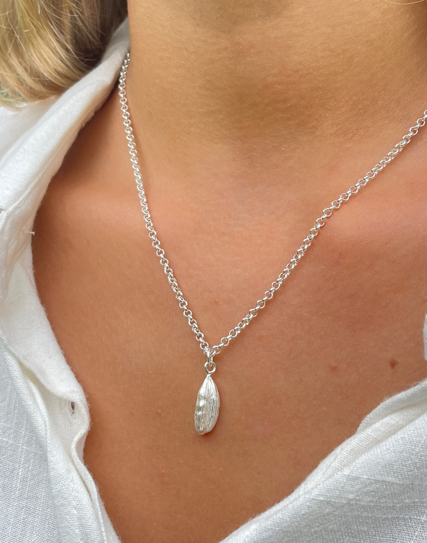 cardamon silver pendant necklace on model