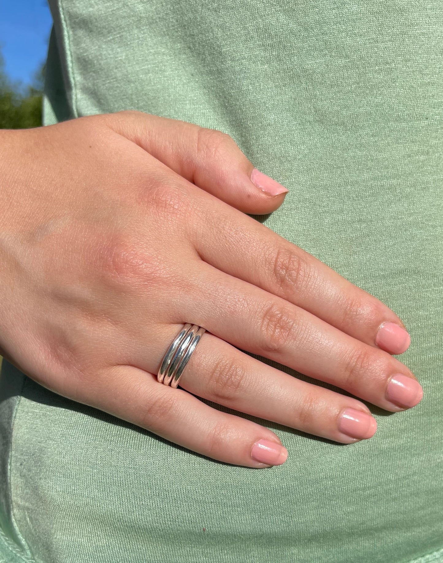 Model wears Silver chunky ring with three bands