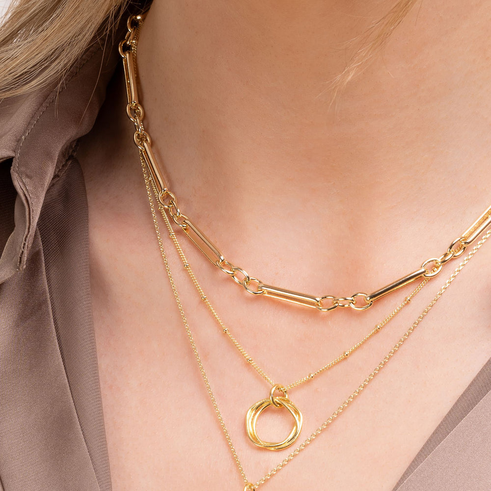 Gold chain necklaces on model