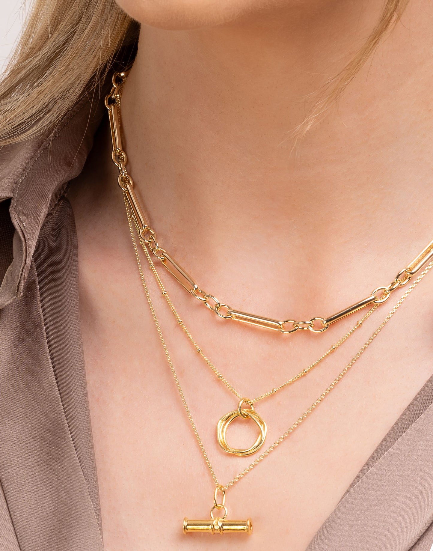 Gold chain necklaces on model