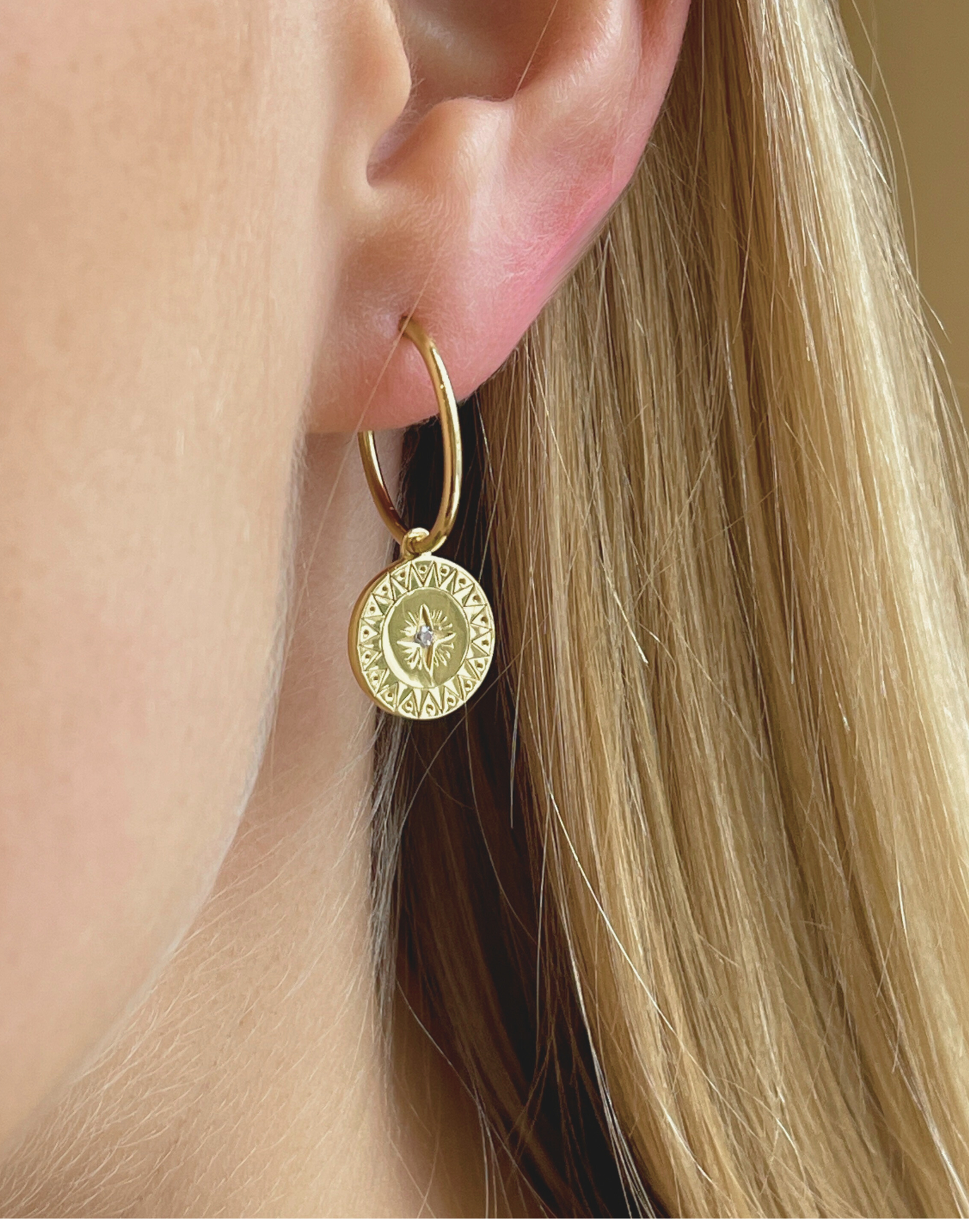 model wears cleo gold hoop earrings