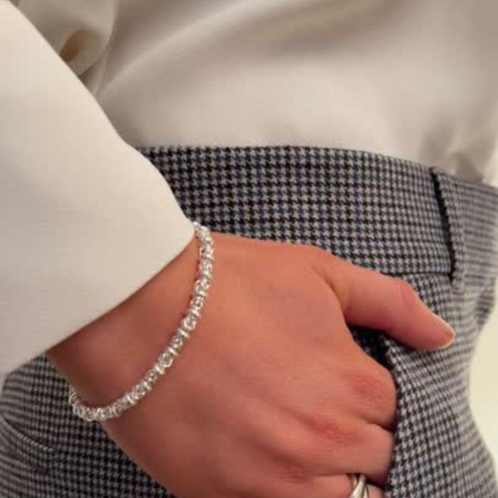 
                  
                    Model wears Dee Silver Link Bracelet
                  
                