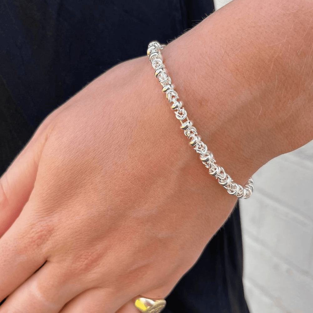 dee Silver link bracelet on a wrist