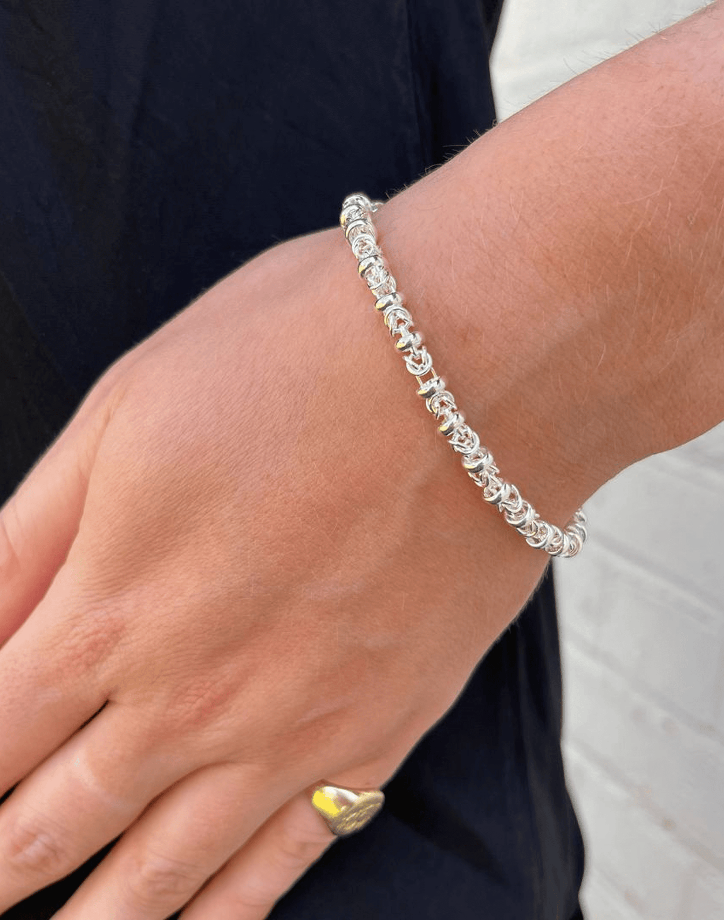 dee Silver link bracelet on a wrist