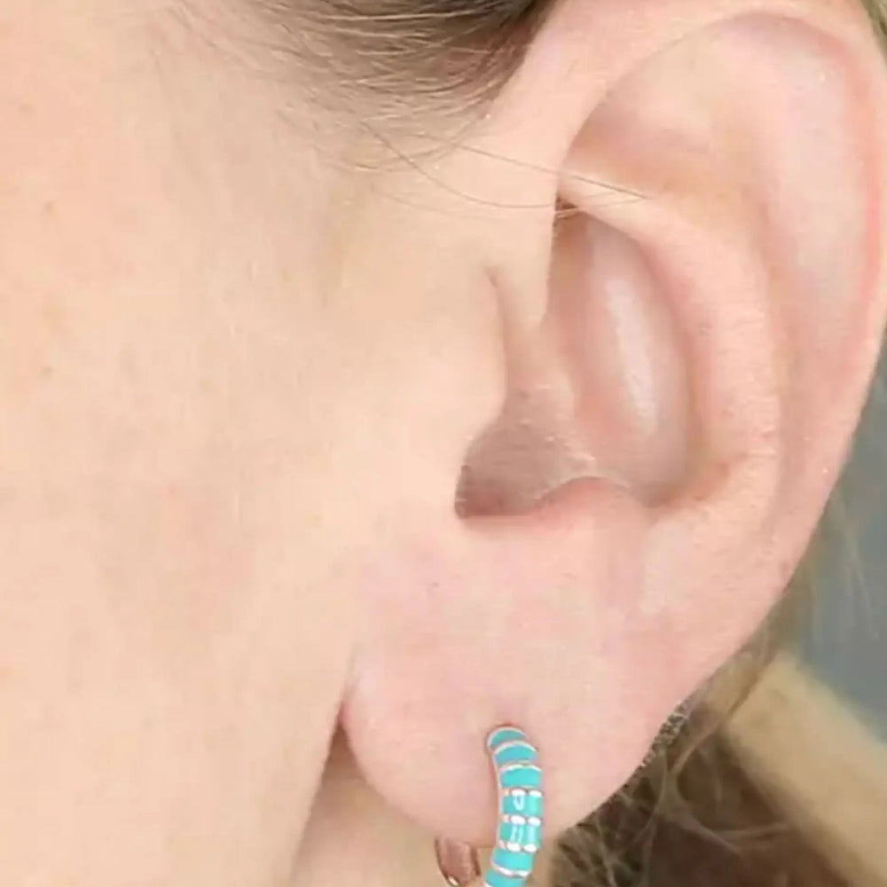 Enamel Turquoise Huggies in ear