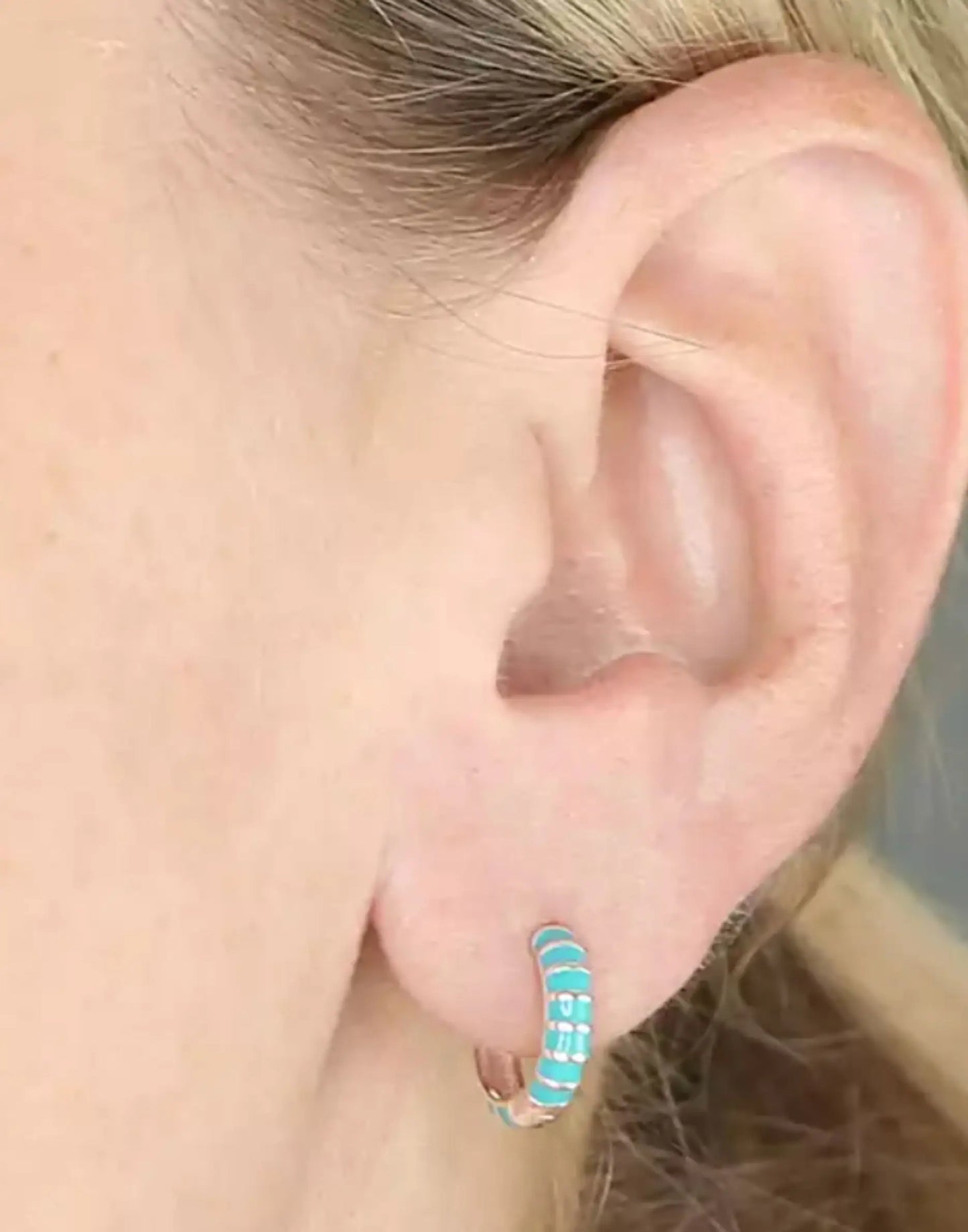 Enamel Turquoise Huggies in ear