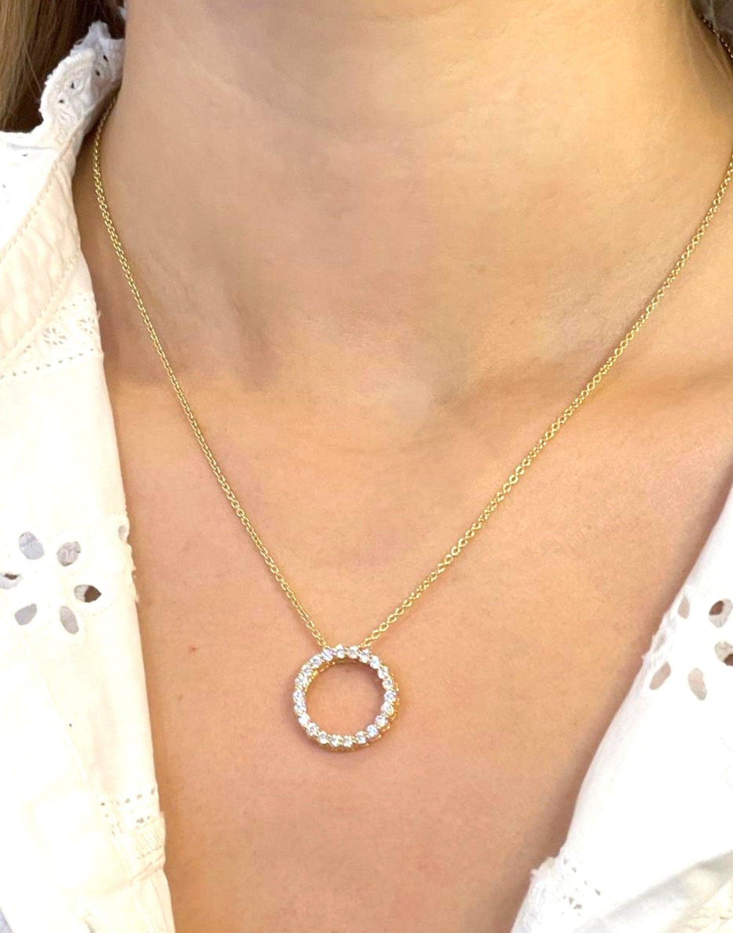 model wears gold circle of life