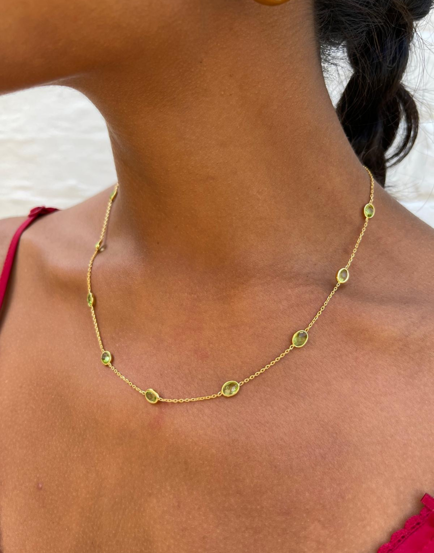 Gold peridot necklace on model