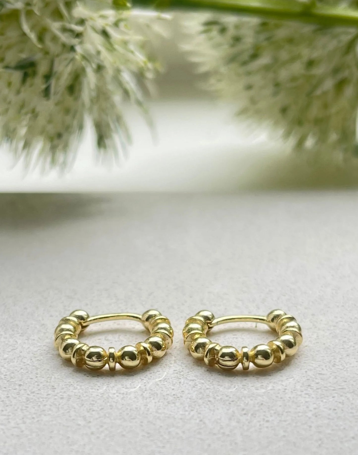 Gold bobble huggies with flowers