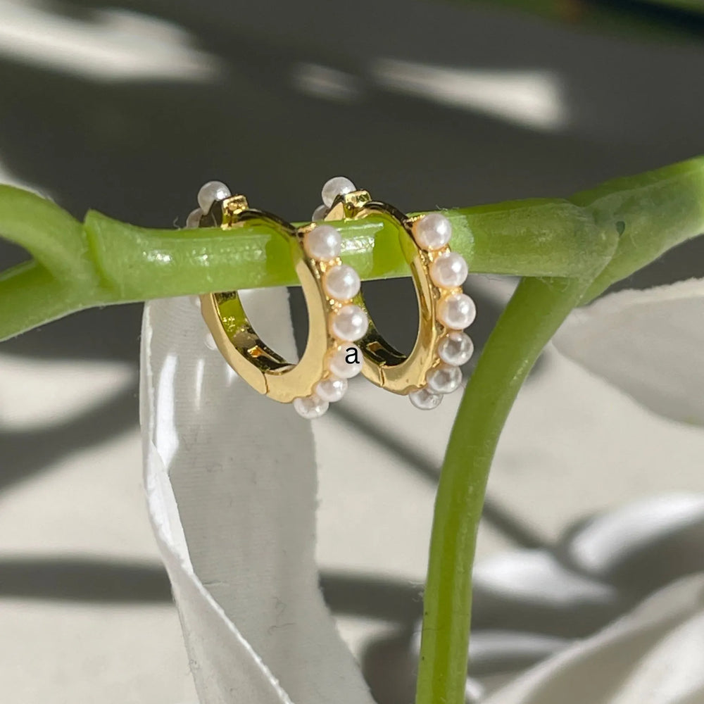 Gold pearl huggie earrings