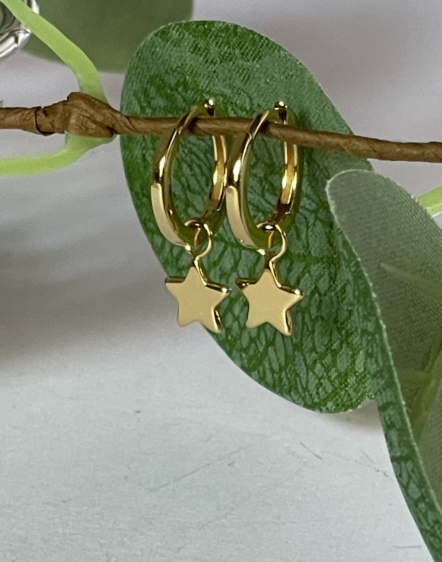 Gold Huggie Earrings with star charm