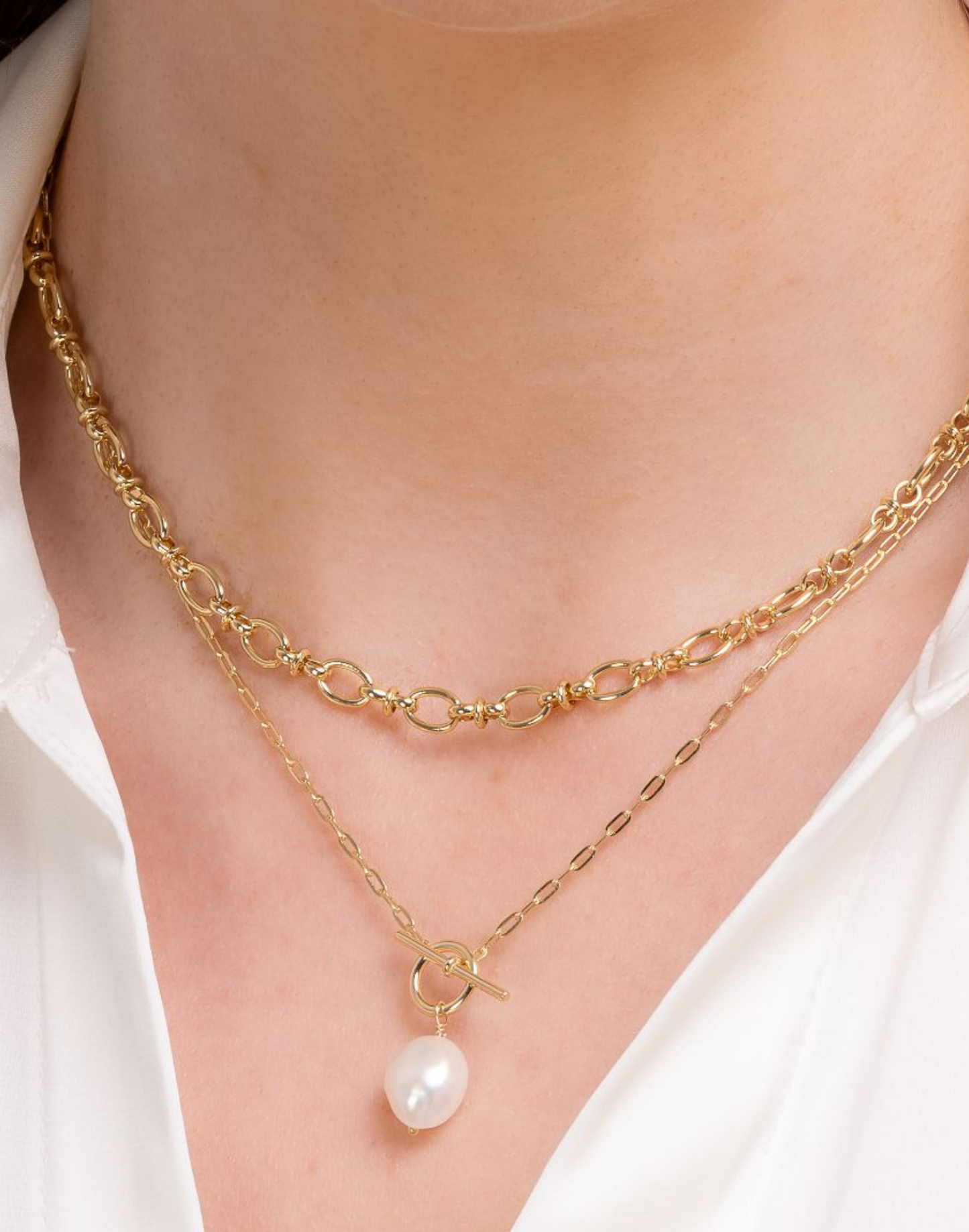 Close up of model wearing Heidi Pearl and gold necklace