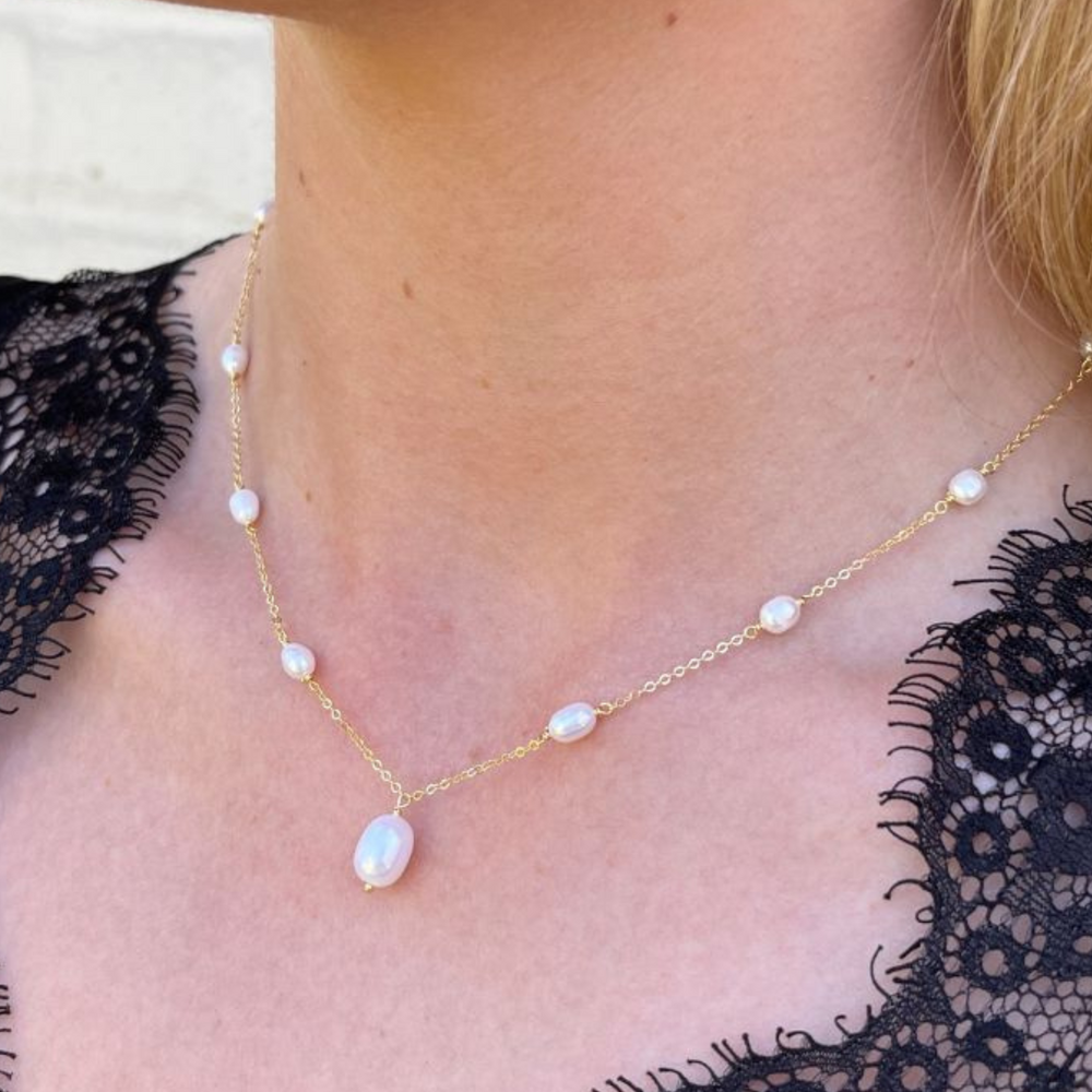 Model wears Helena Gold and Pearl Drop Necklace
