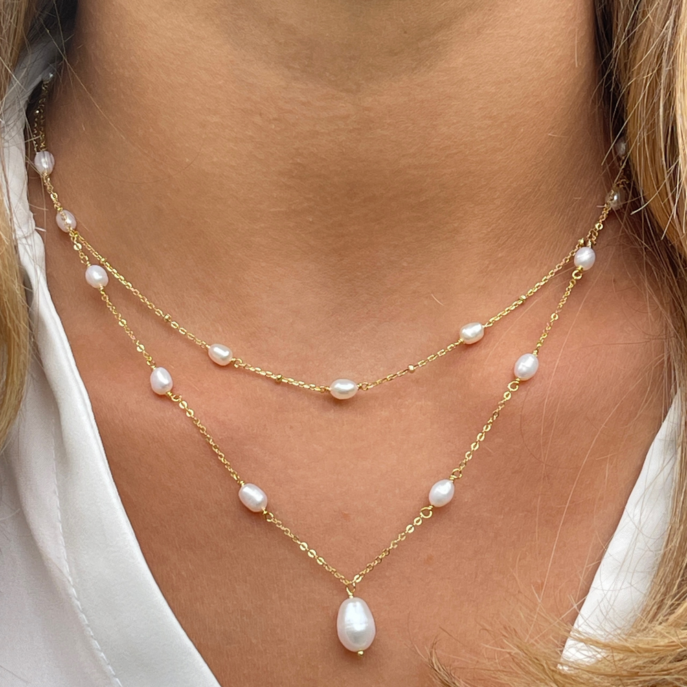 model wearing gold Helena Pearl Necklace Set