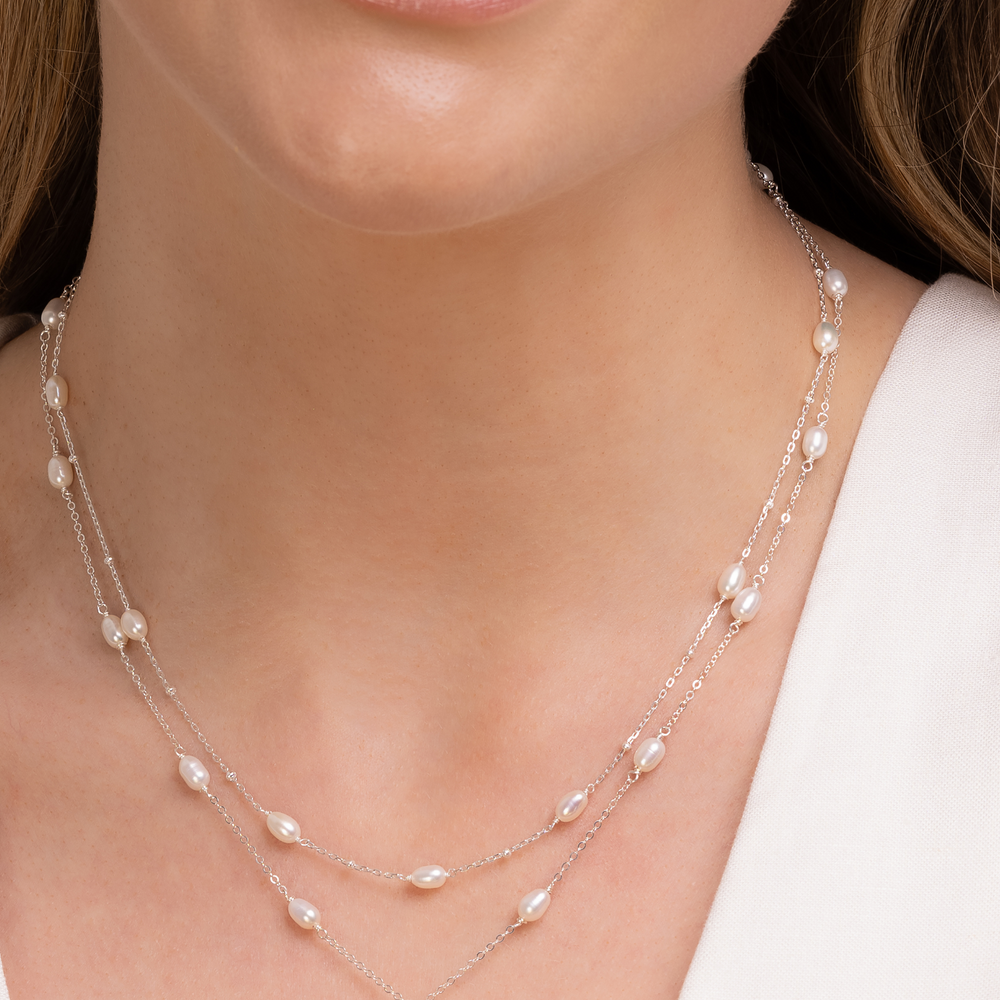 
                  
                    Helena Pearl necklace set - silver on model
                  
                