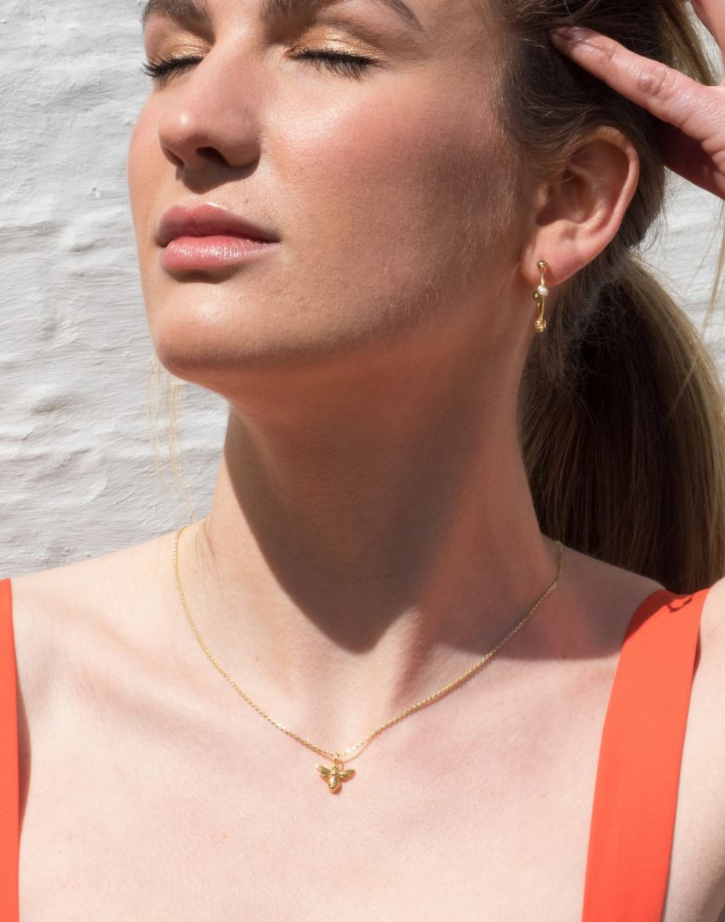 model wears honey bee gold pendant necklace