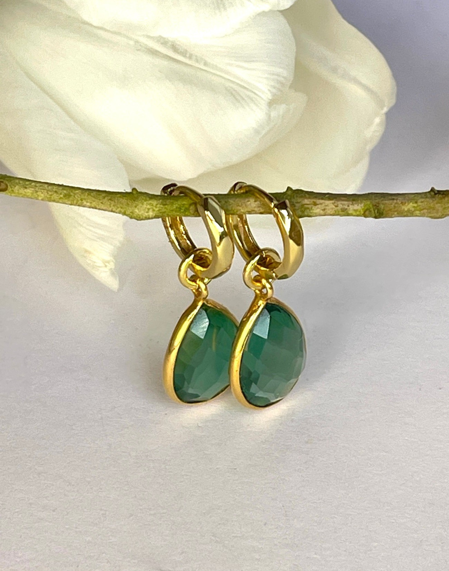Kiera Forest Green Drop Earrings with a flower