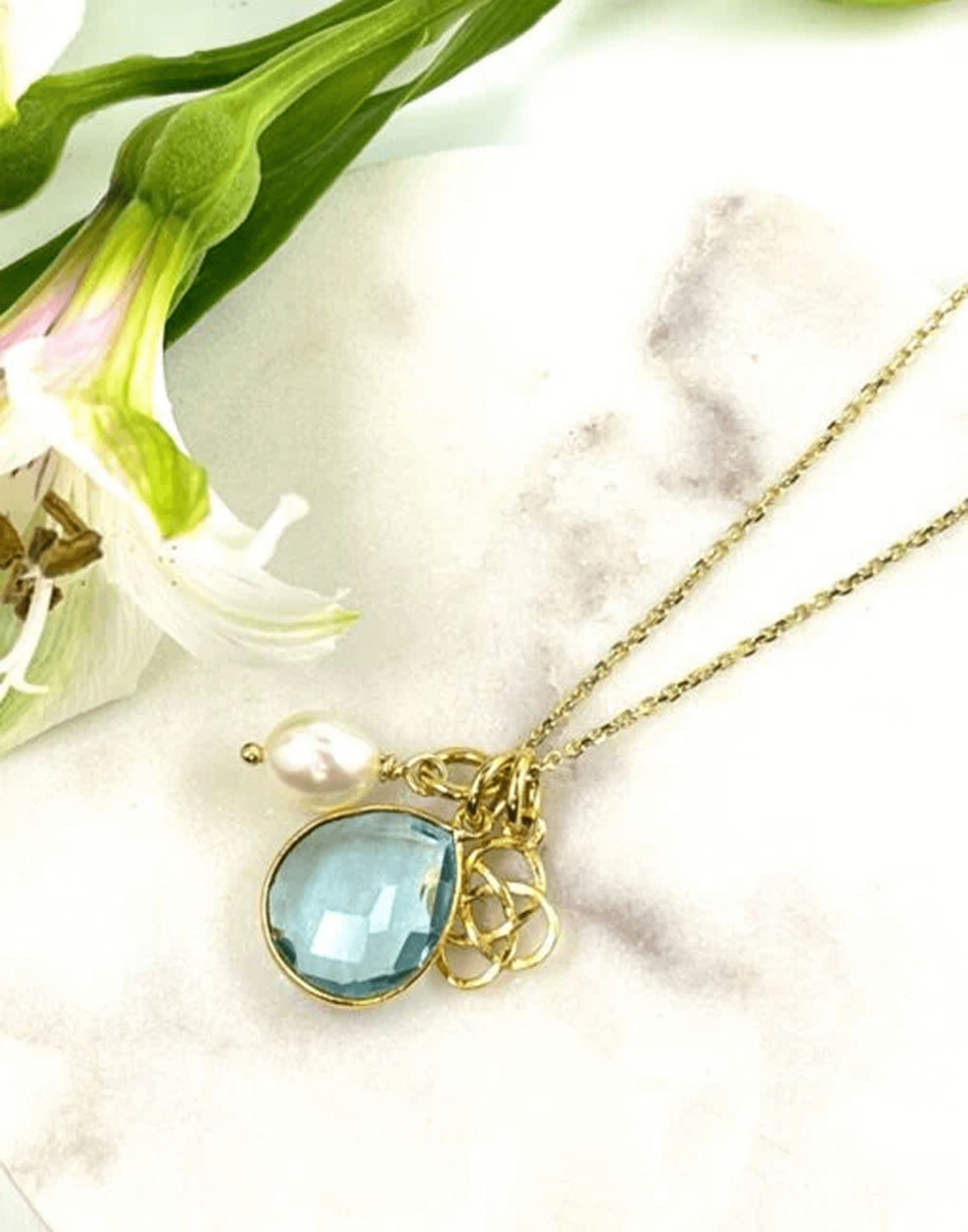 Blue topaz charm necklace with interchangeable charms