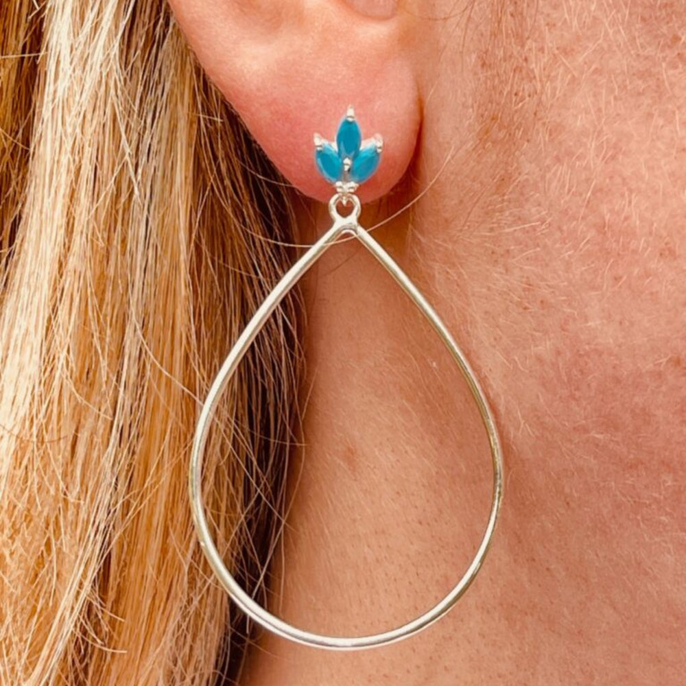 Lotus flower silver turquoise drop earrings in ear