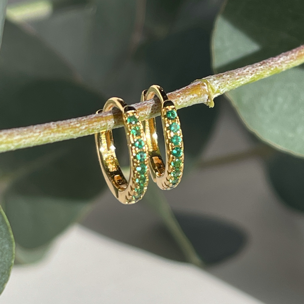 May birthstone gold huggie earrings