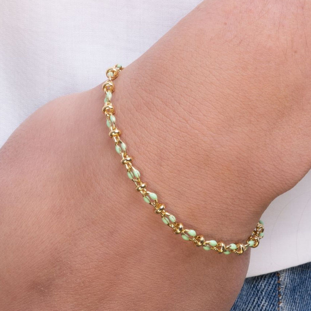 
                  
                    Model wears mint green enamel bracelet
                  
                