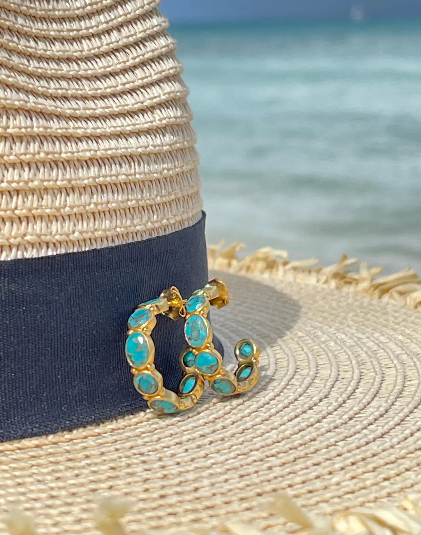 Mojave hoop earrings on hat