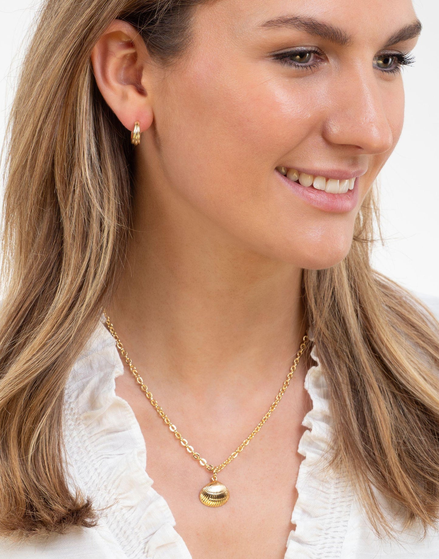 Model wears Olivia Small Gold Hoop Earrings