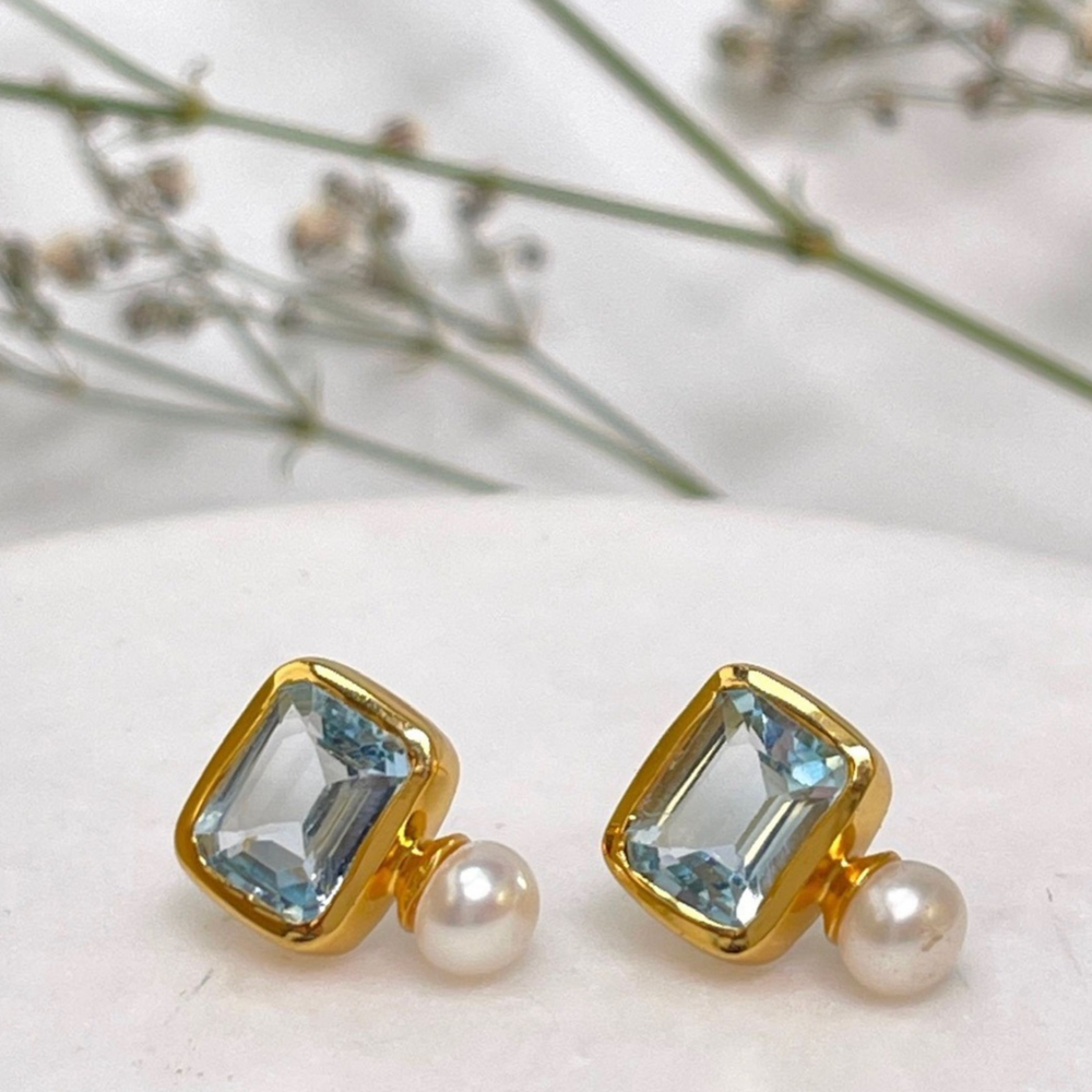 pearl and blue topaz studs with flowers