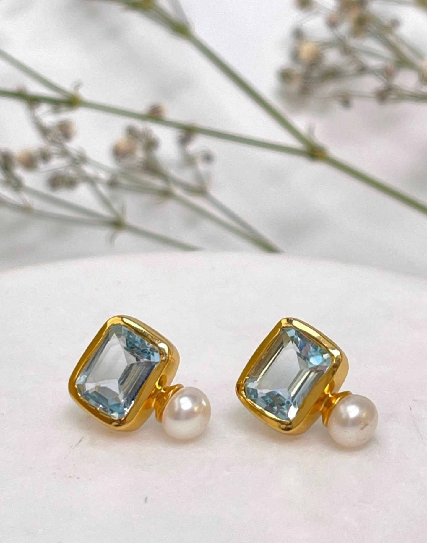 pearl and blue topaz studs with flowers
