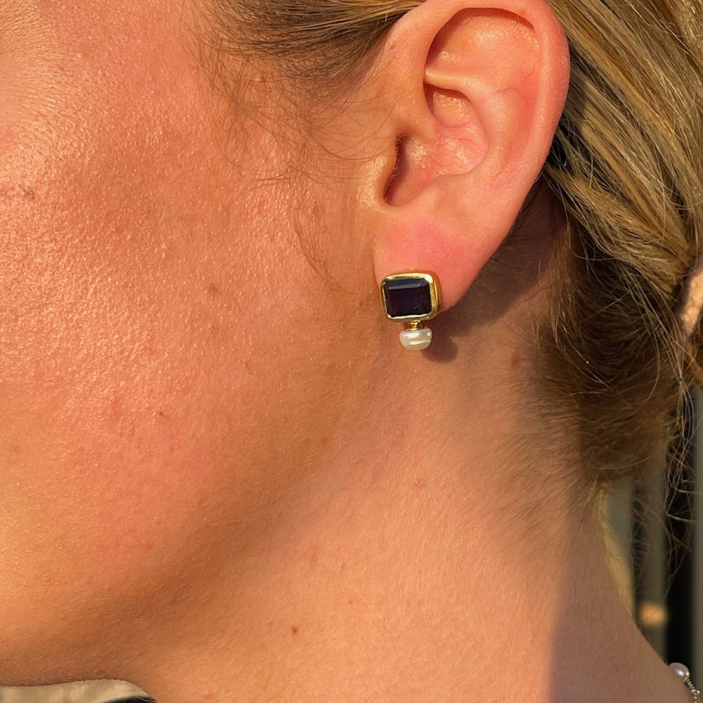 pearl and iolite stud earrings on model