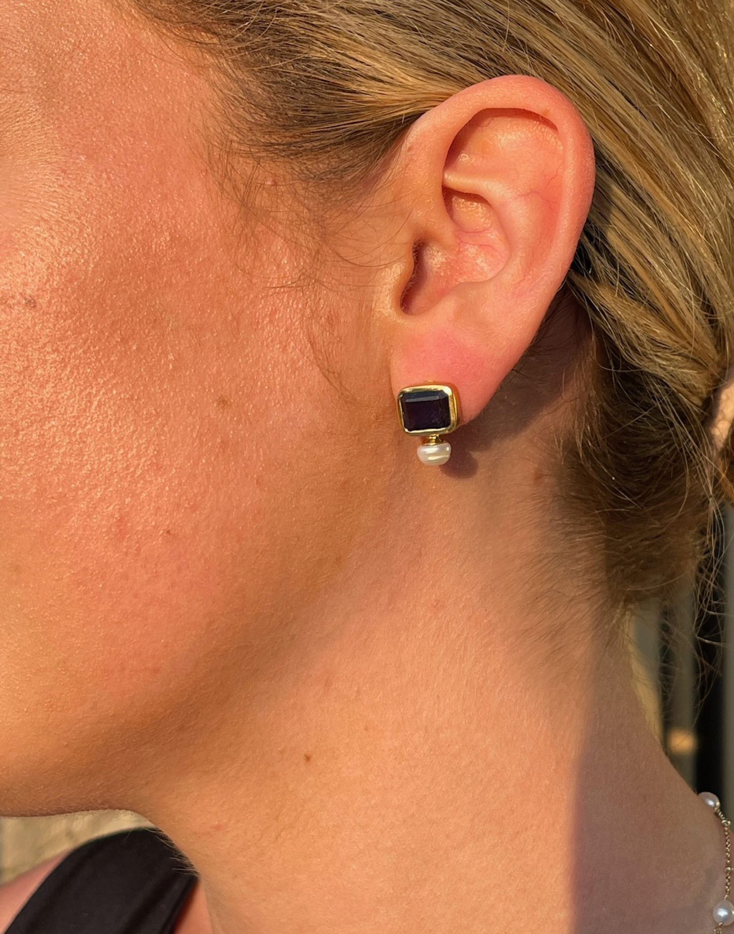 pearl and iolite stud earrings on model