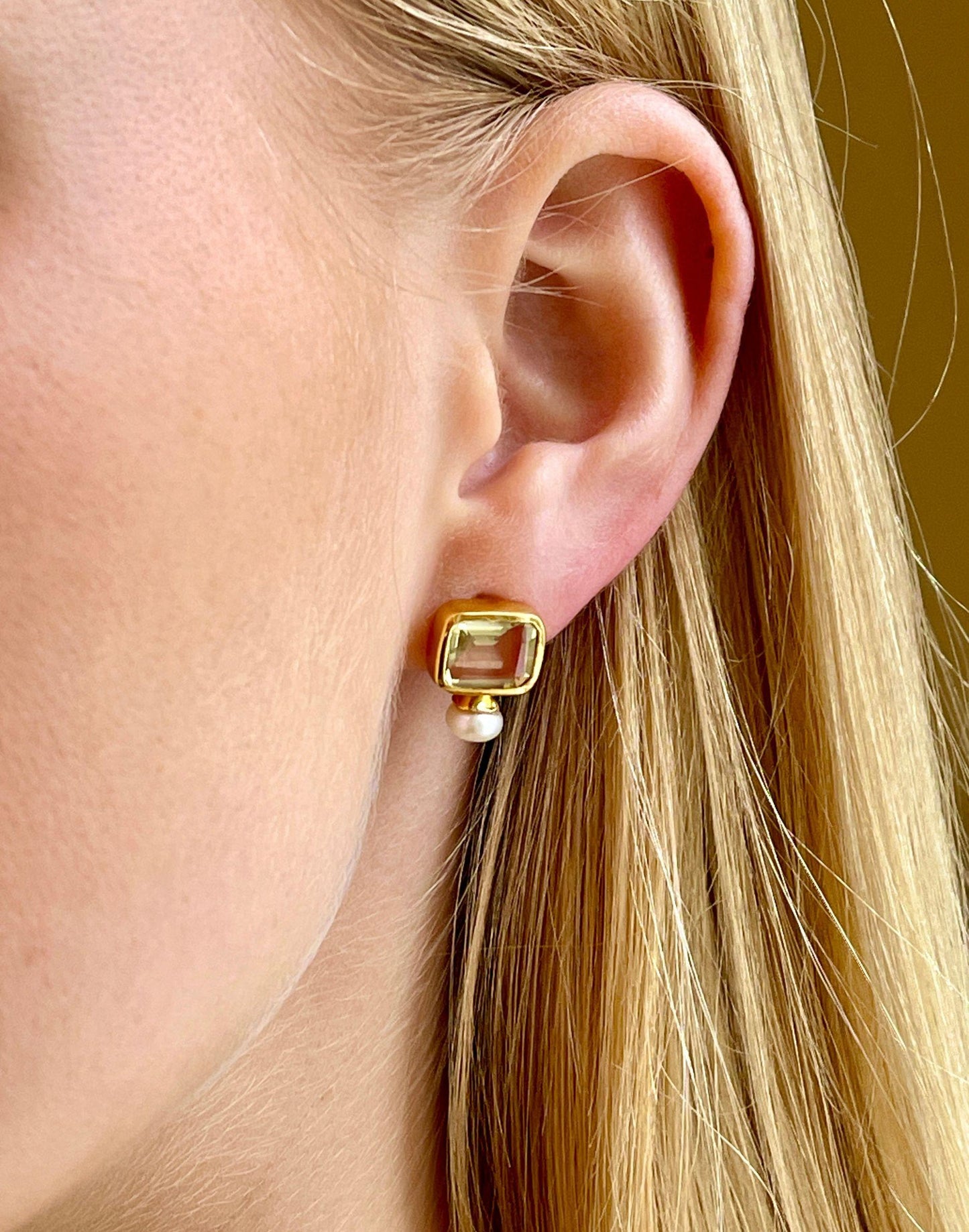 model wears pearl and lemon quartz stud earrings