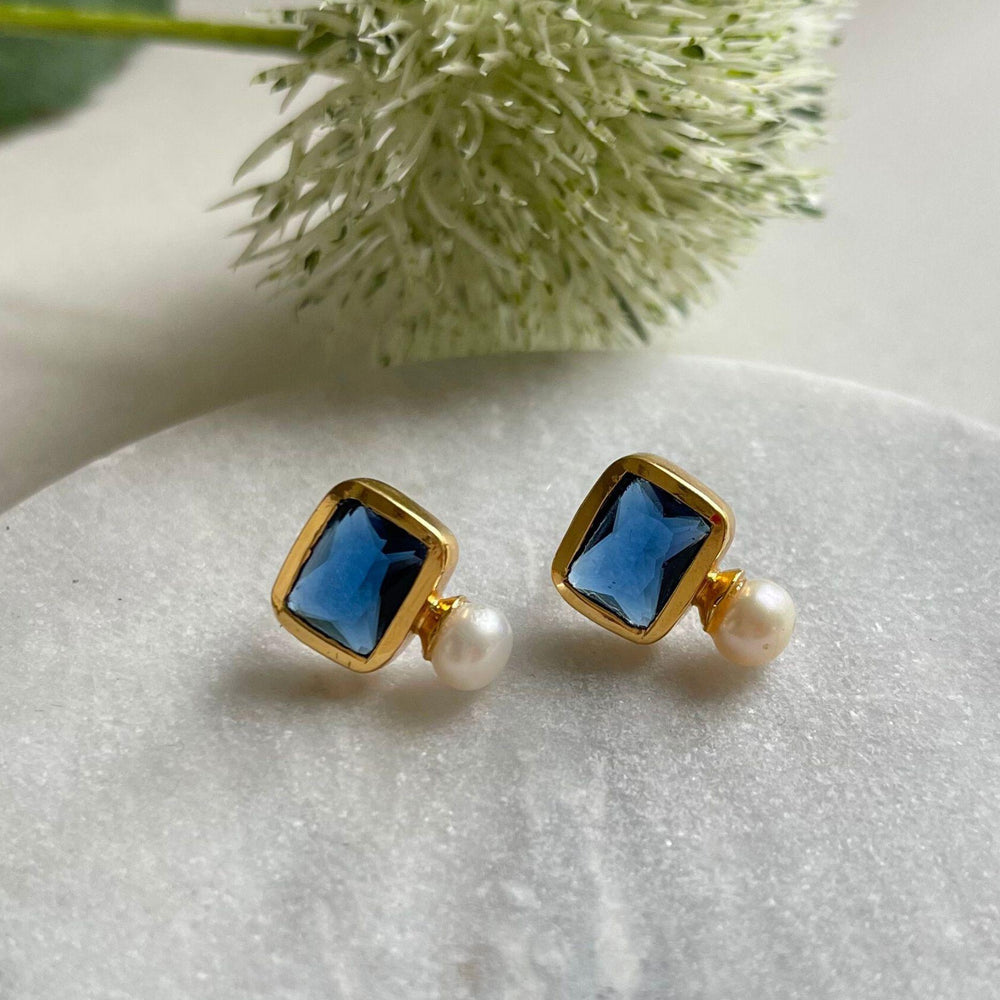 Pearl and navy stone stud earrings in gold plated silver