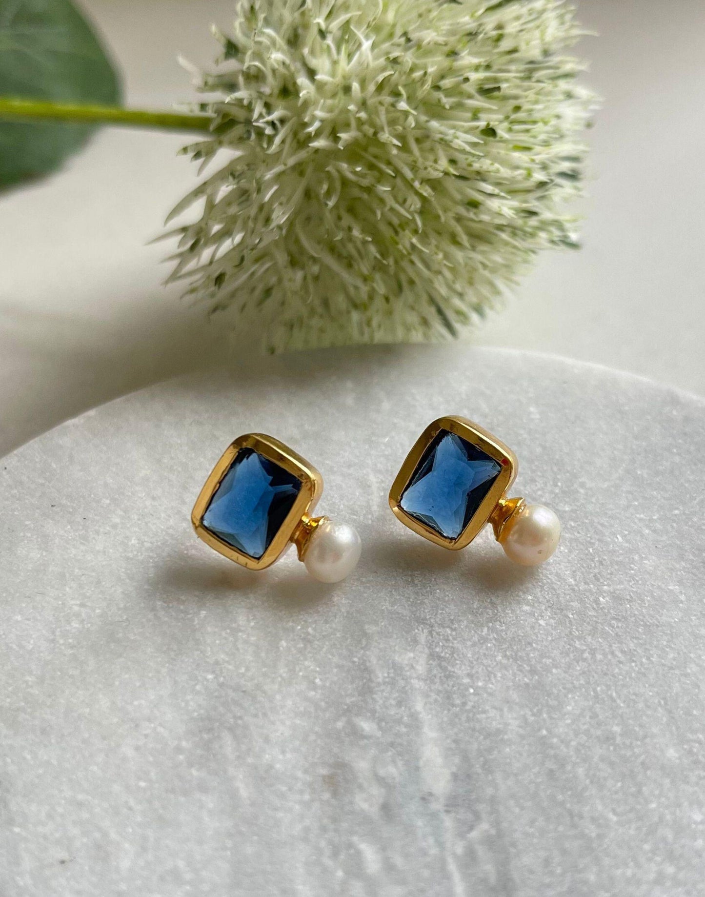 Pearl and navy stone stud earrings in gold plated silver