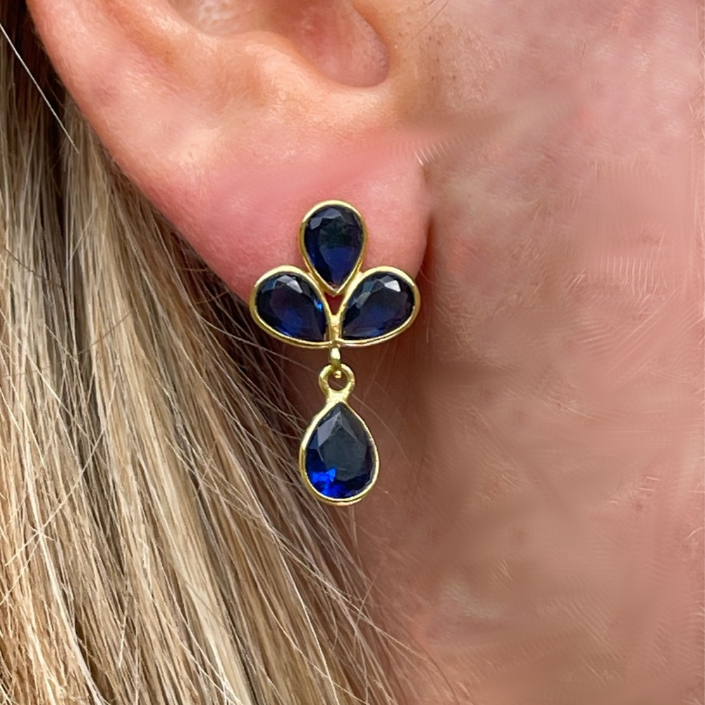 Petal Dark Blue Topaz Gold Earrings on model
