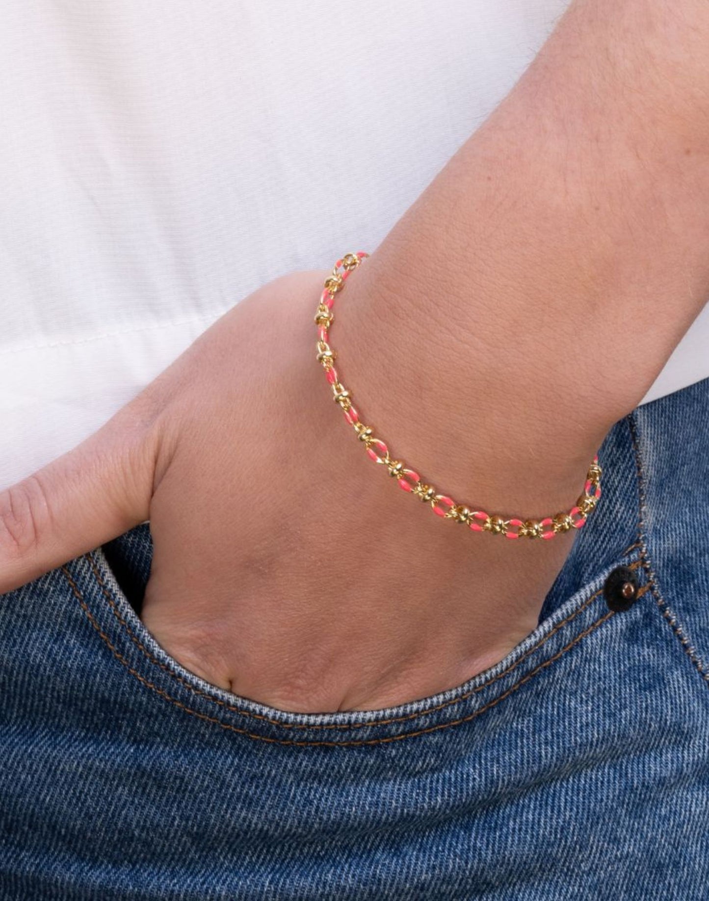 Model wears pink enamel bracelet