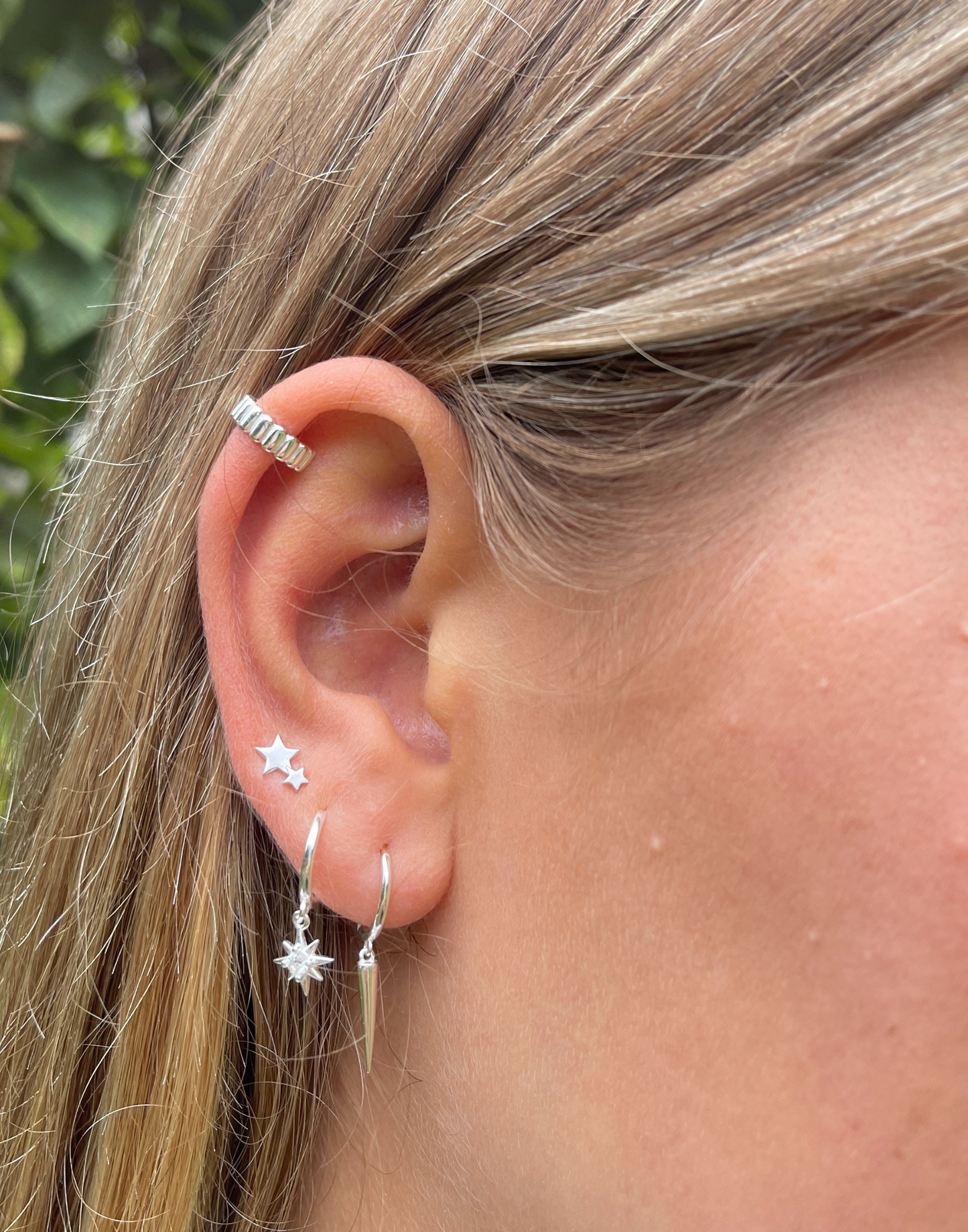 model wearing ridged silver ear cuff