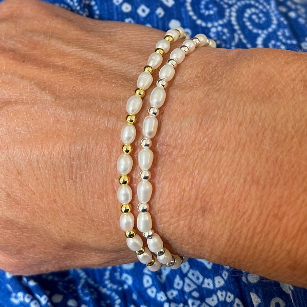
                  
                    Model wears Sadie pearl and gold bracelet with Sadie pearl and silver bracelet
                  
                