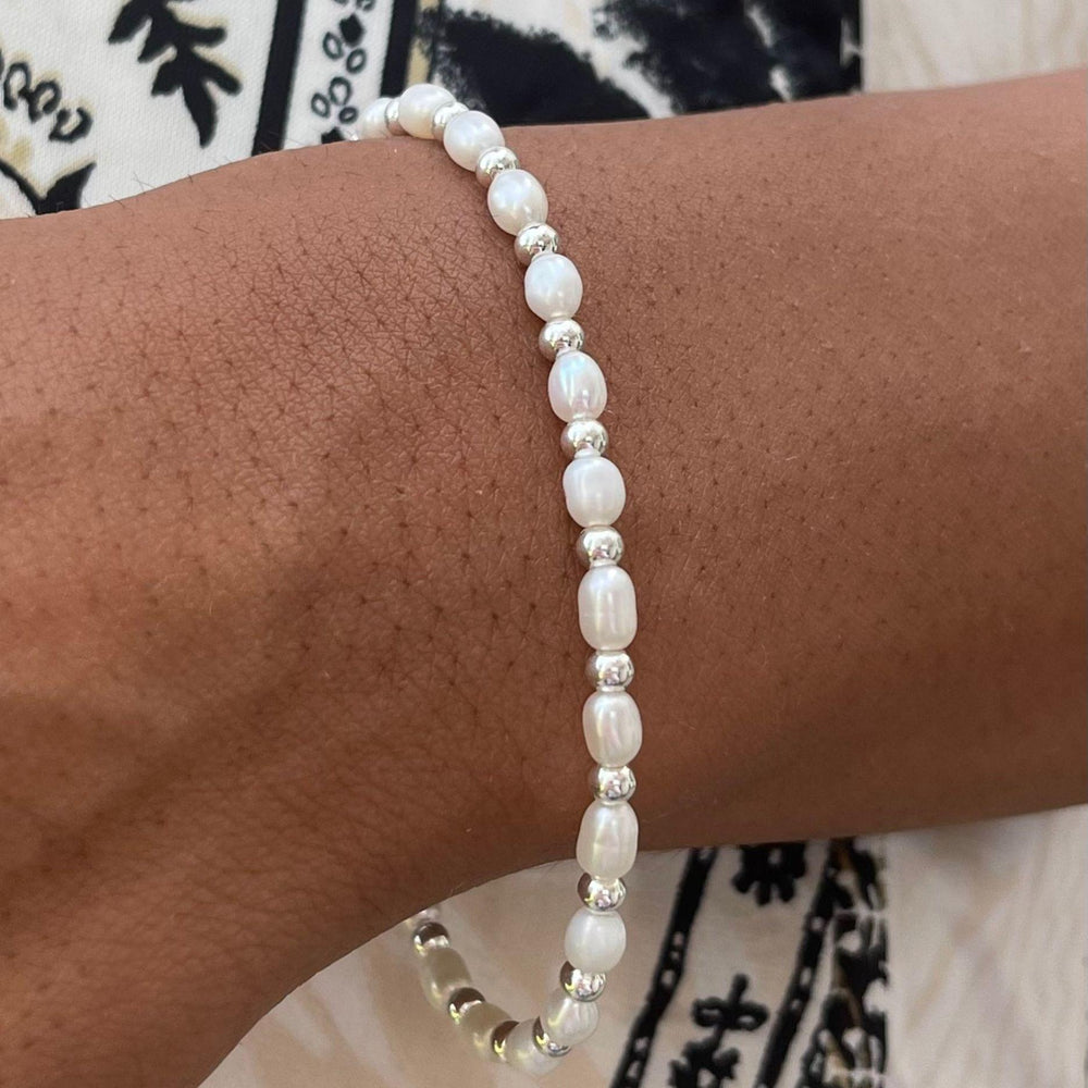 Model wears Sadie Pearl and Silver Bracelet on wrist
