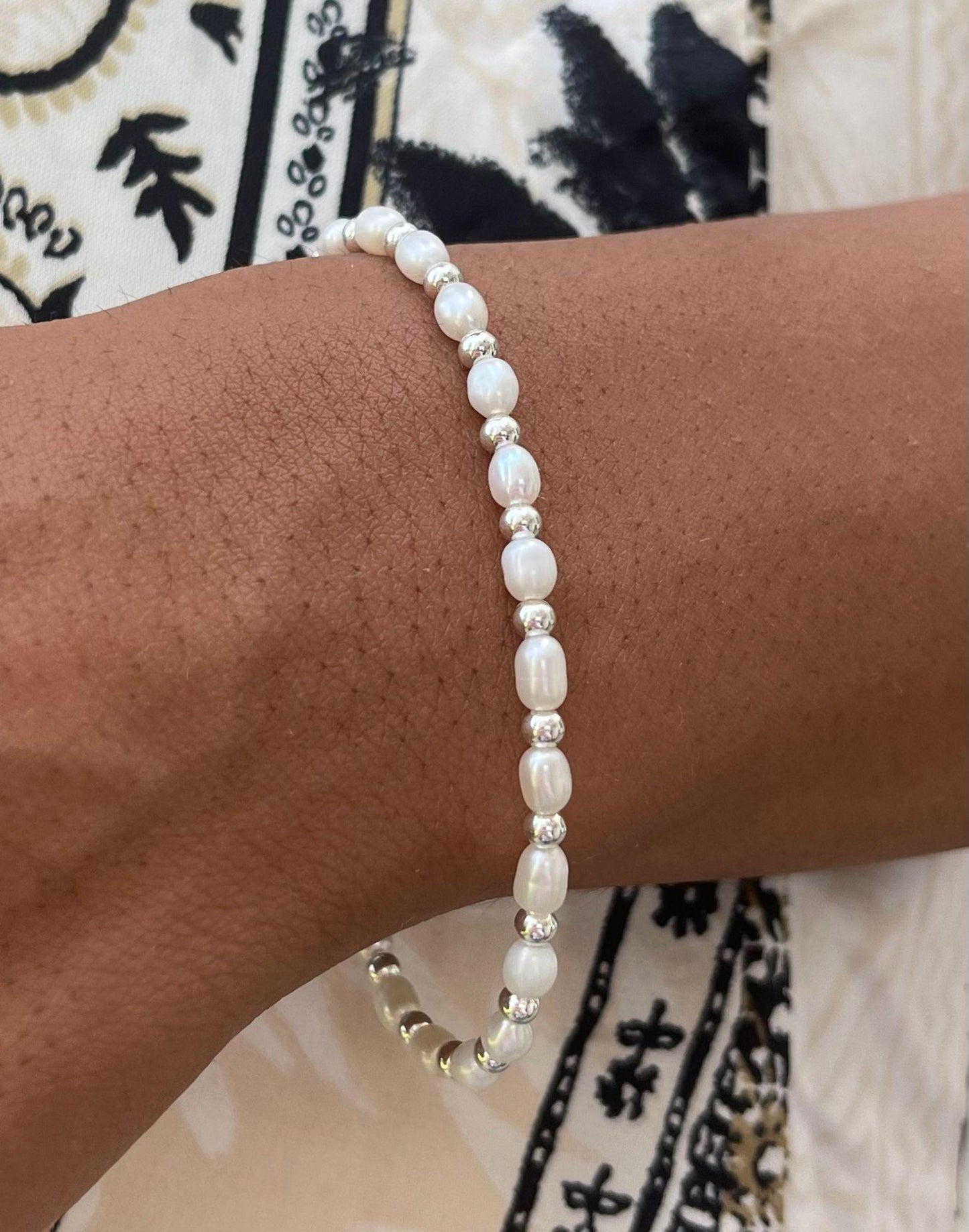 Model wears Sadie Pearl and Silver Bracelet on wrist