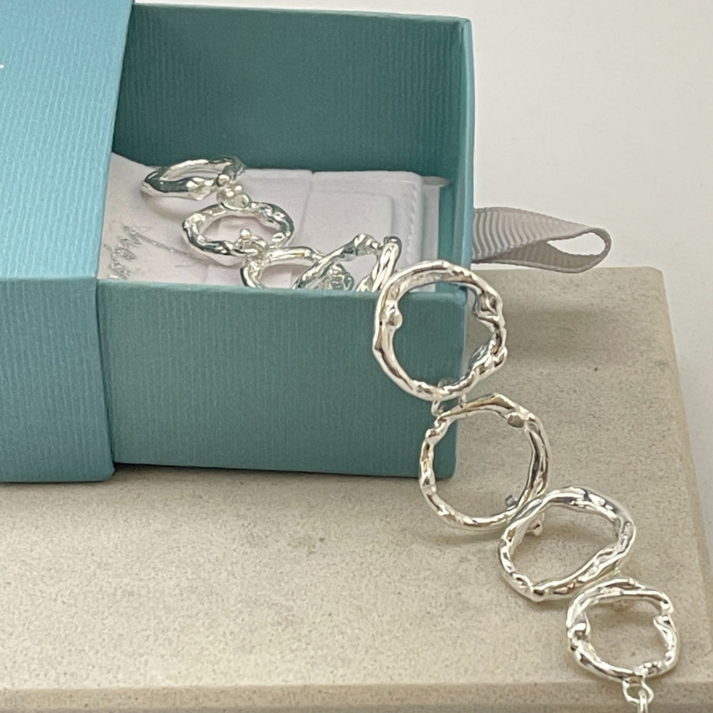 Stylish Chole Sterling Silver Bracelet on a tile