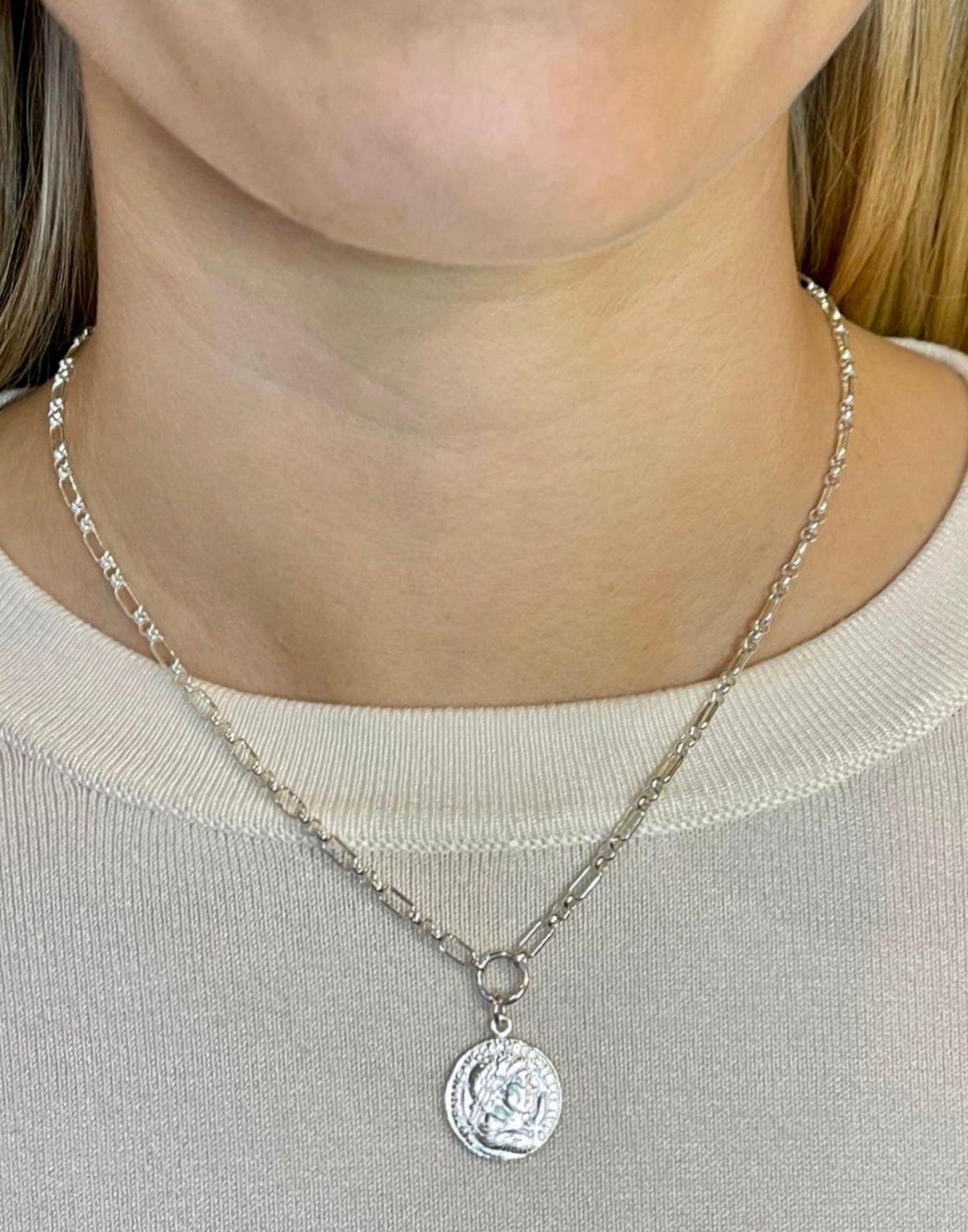 Model wears silver coin necklace