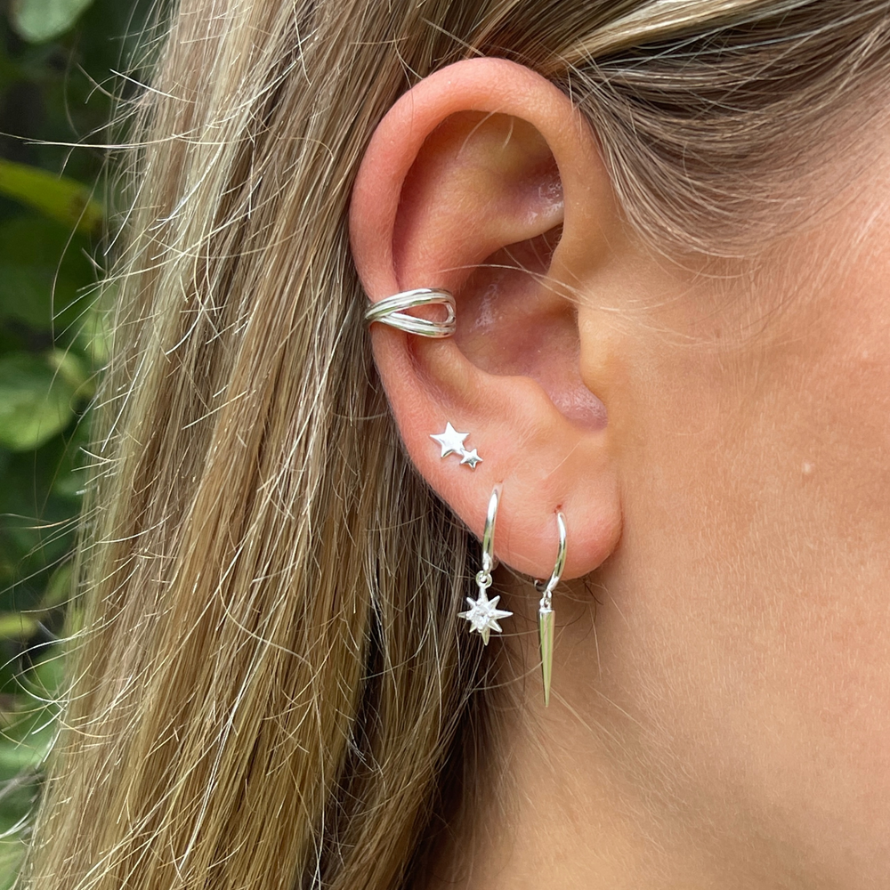 Model wears silver criss cross ear cuff