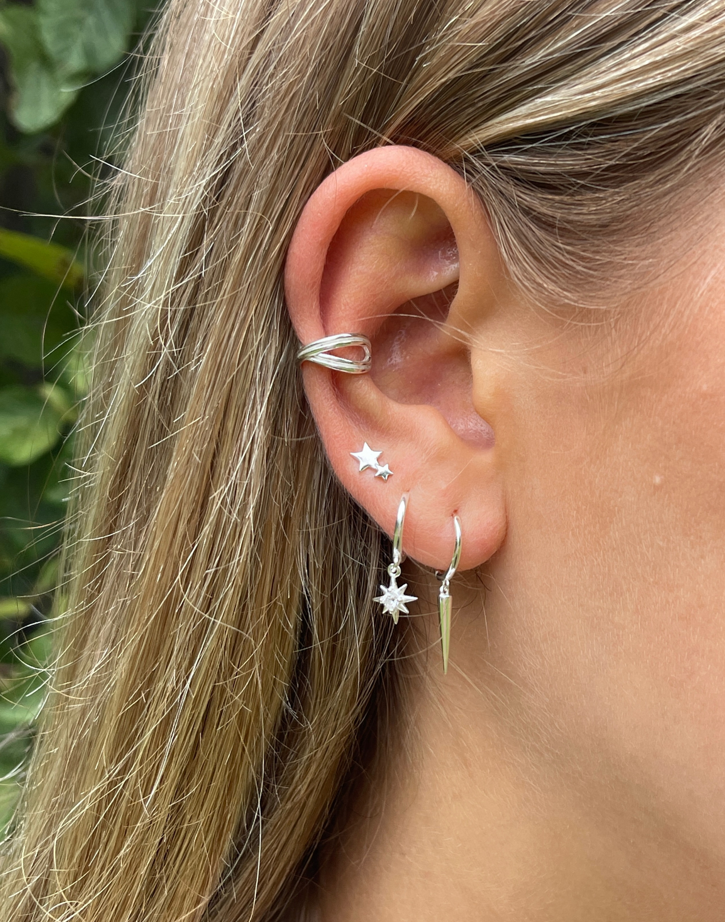 Model wears silver criss cross ear cuff